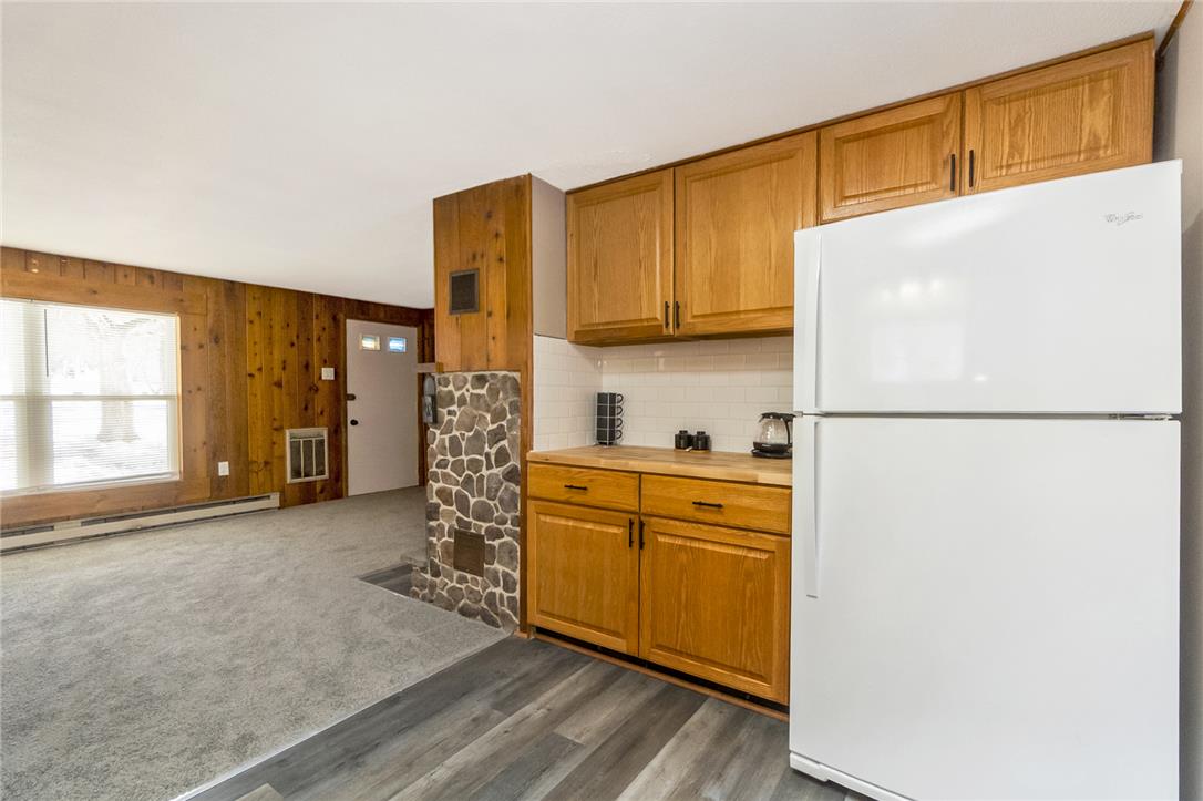 121 Short Ridge Road Albrightsville, PA 18210 - Photo 35 of 35 An open floorplan seamlessly connects the functional kitchen area with the adjacent carpeted living space.