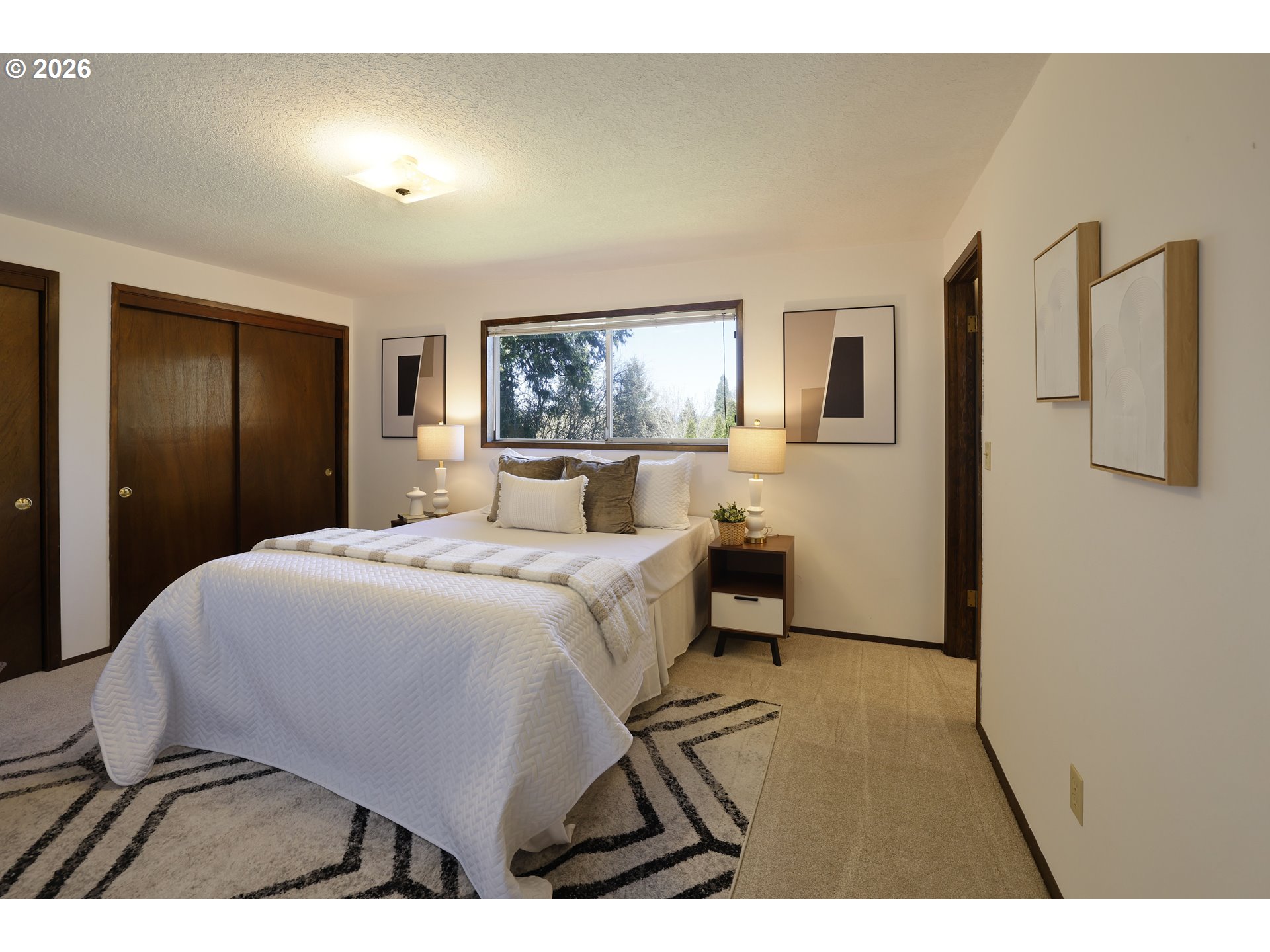 16285 Southwest Rosa Road Beaverton, OR 97007 - Photo 8 of 20 a bedroom with a bed and a painting on the wall