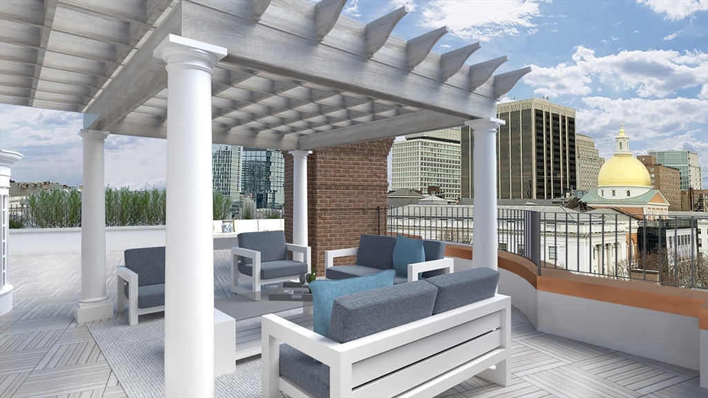 34.5 Beacon Street, Unit PH Boston, MA 02116 - Photo 6 of 11 a view of living room and balcony