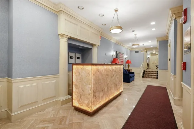 a view of a hallway with a living room