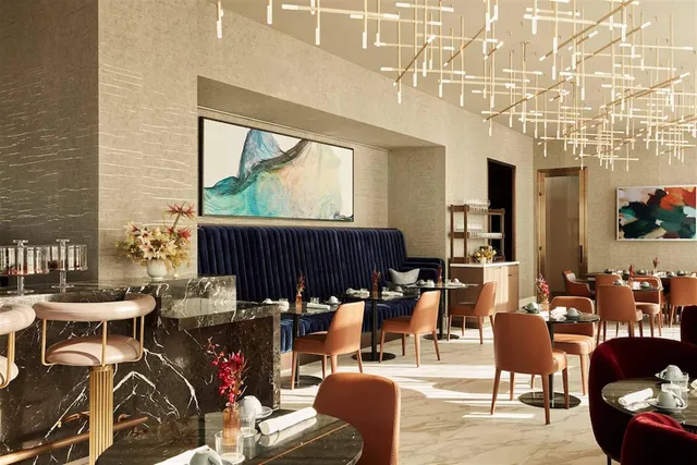 a living room with lots of furniture and a large window