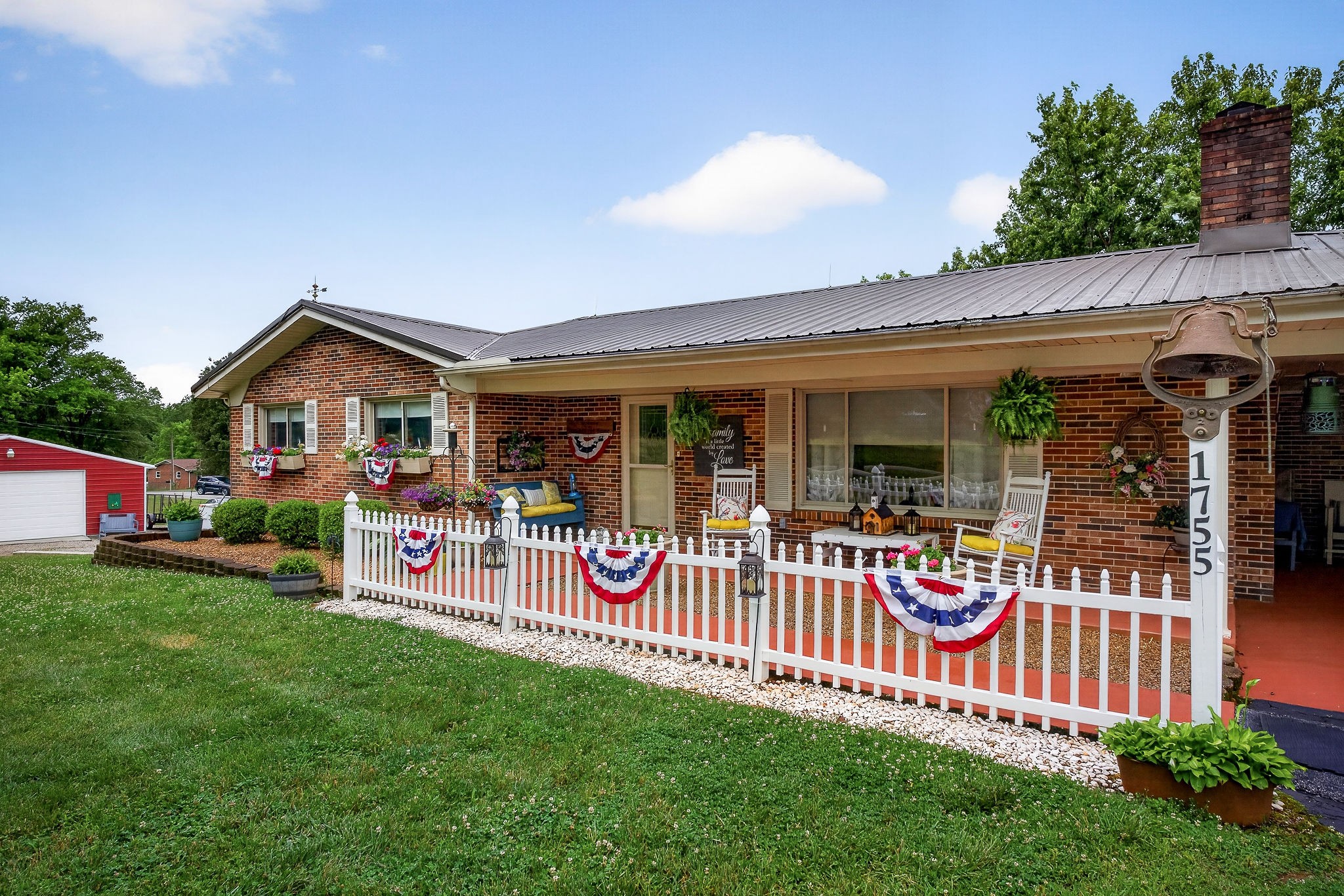 1755 Burgess Falls Road Sparta, TN 38583 - Photo 2 of 56 a front view of a house with garden
