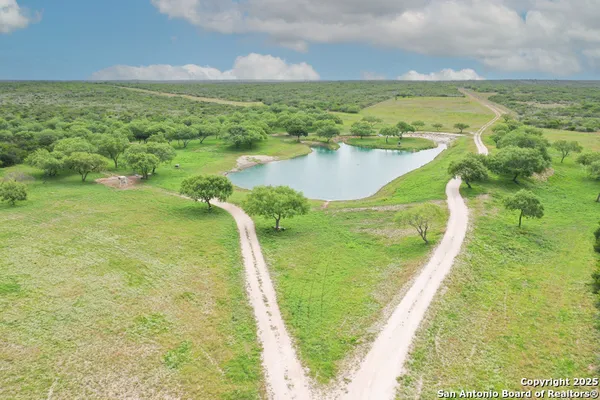 a view of a lake with a big yard