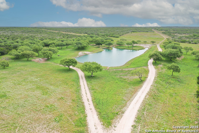 a view of a lake with a big yard