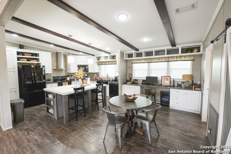 0 Tbd San Diego, TX 78384 - Photo 27 of 42 a kitchen with a dining table chairs and refrigerator