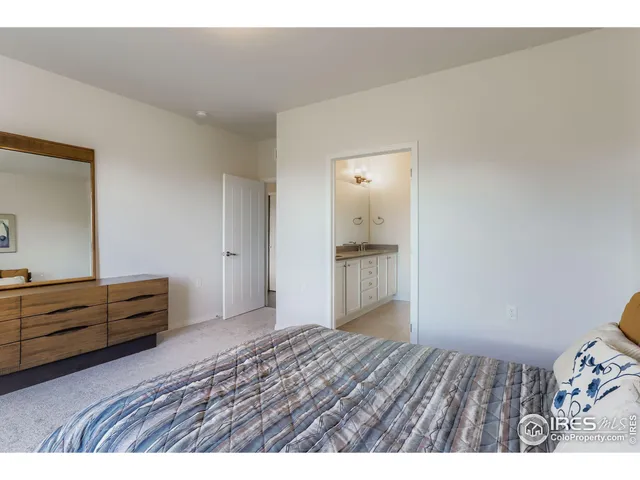 a view of room with wooden floor and cabinet
