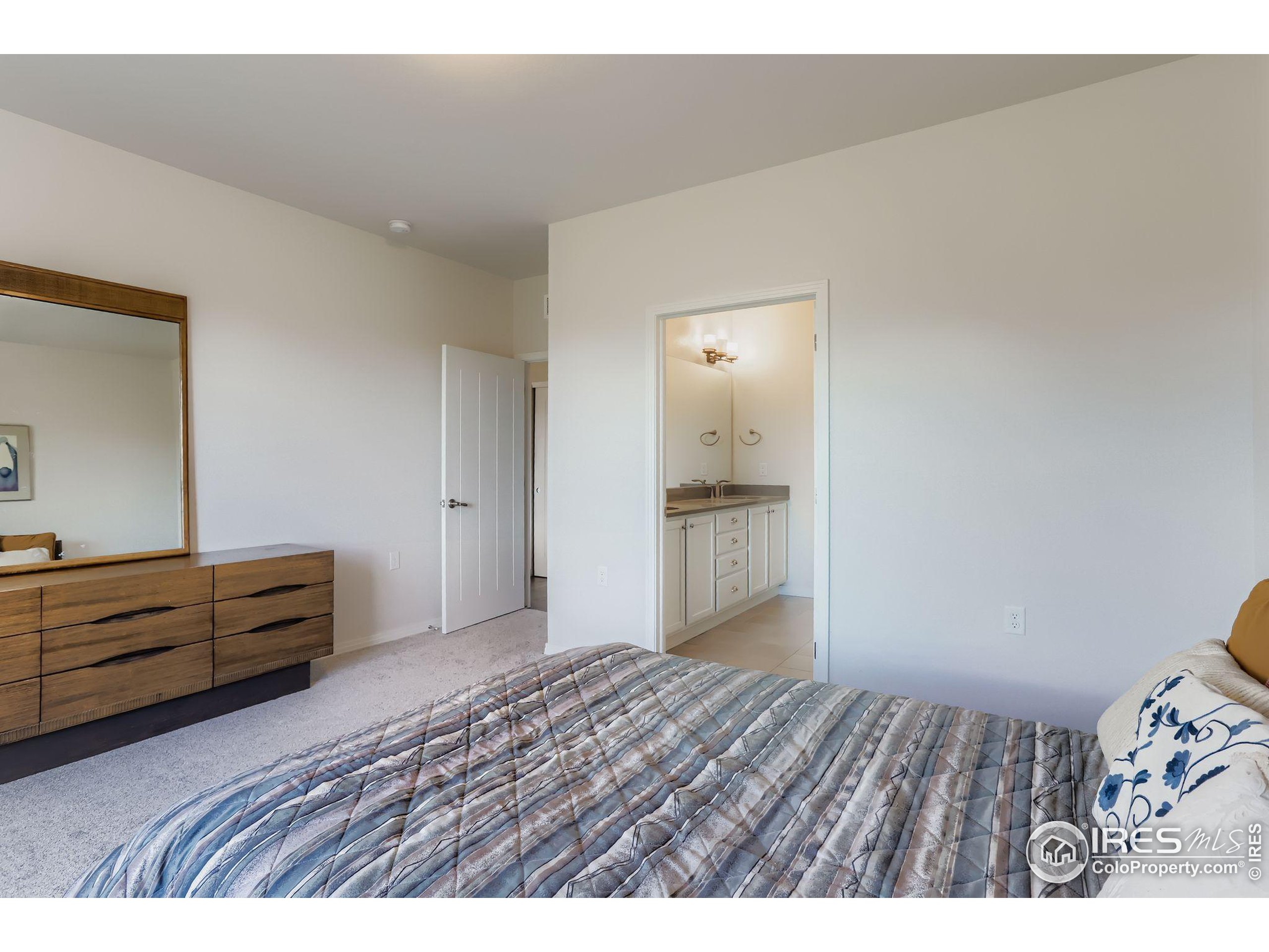 671 Brennan Circle Erie, CO 80516 - Photo 14 of 26 a view of room with wooden floor and cabinet