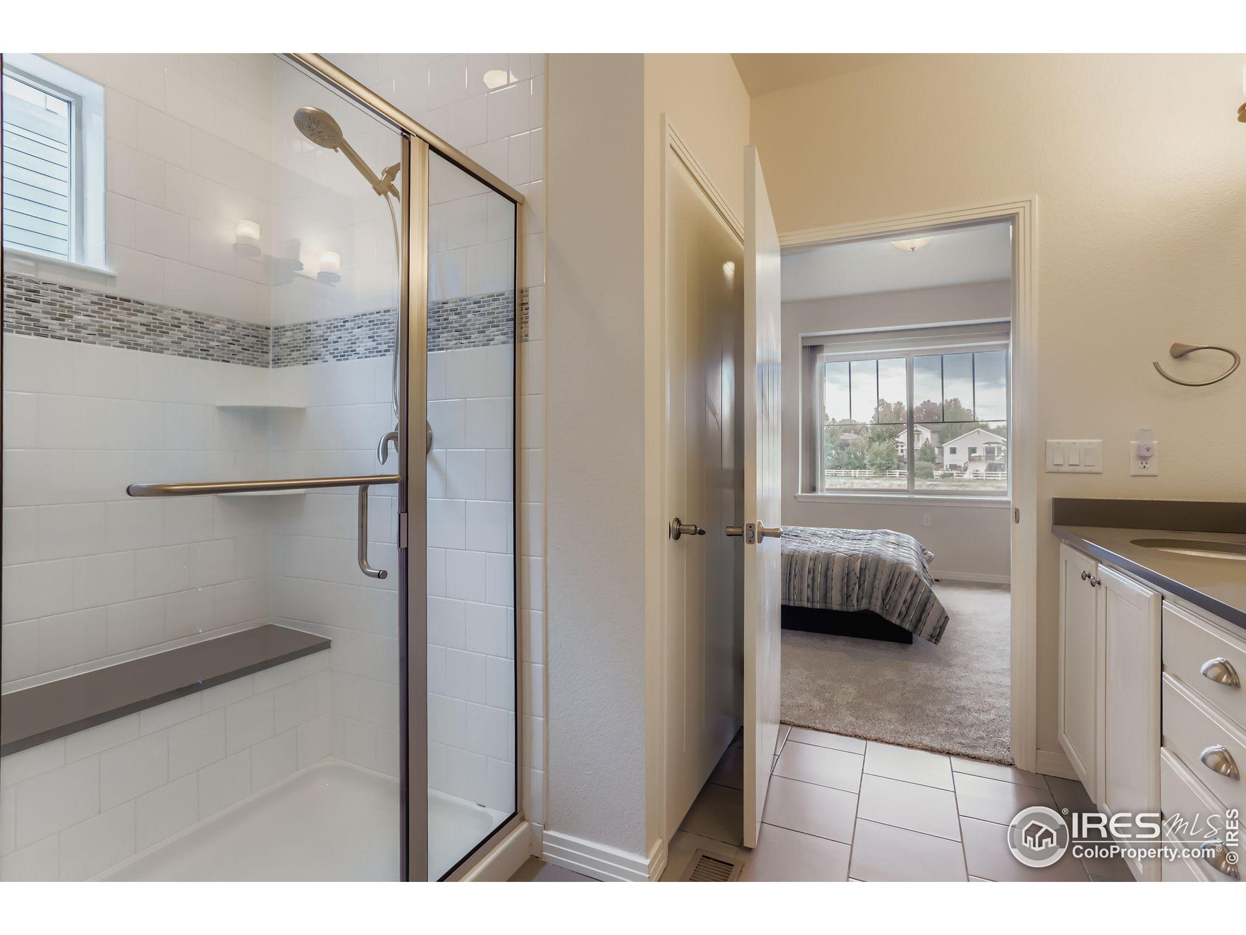 671 Brennan Circle Erie, CO 80516 - Photo 16 of 26 a kitchen with a refrigerator and a sink