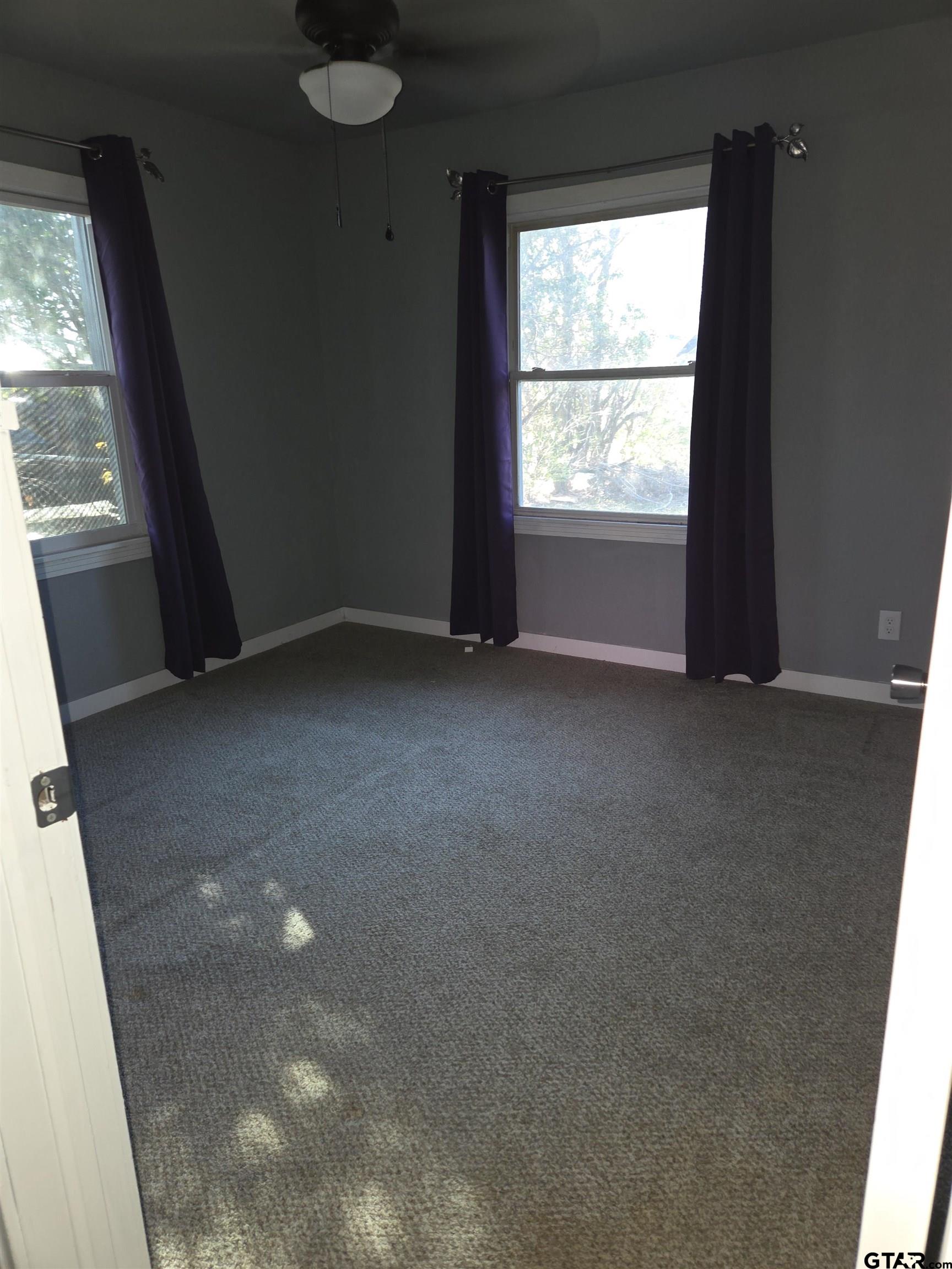 124 Foscue Street Sulphur Springs, TX 75482 - Photo 4 of 8 a view of empty room with a window