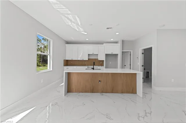 $299,900 | 1111 Dutchess Street East, Lehigh Acres, FL 33974