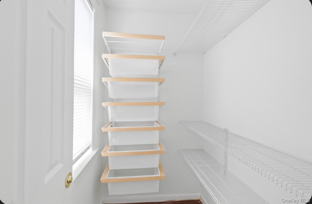 17 Edgar Place Port Chester, NY 10573 - Photo 13 of 18 Walk in closet with dark wood-style floors