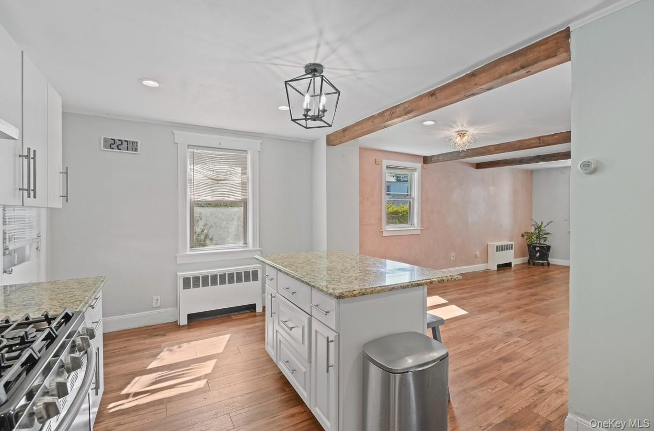 17 Edgar Place Port Chester, NY 10573 - Photo 8 of 18 Kitchen with white cabinets, decorative light fixtures, beam ceiling, healthy amount of natural light, and recessed lighting