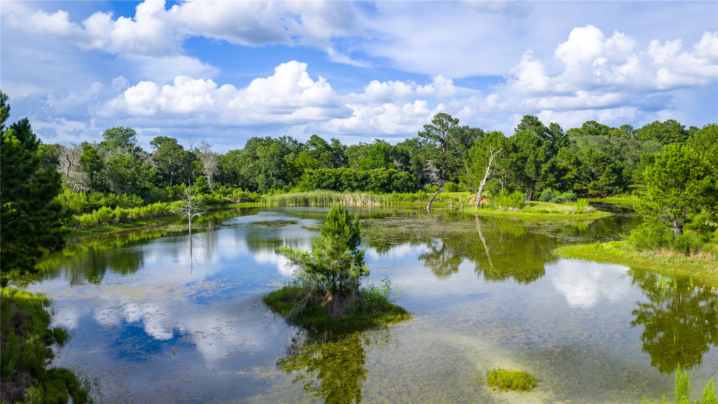 2080 Zimmerscheidt Road Columbus, TX 78934 - Photo 14 of 15 a view of a lake with a house in the background