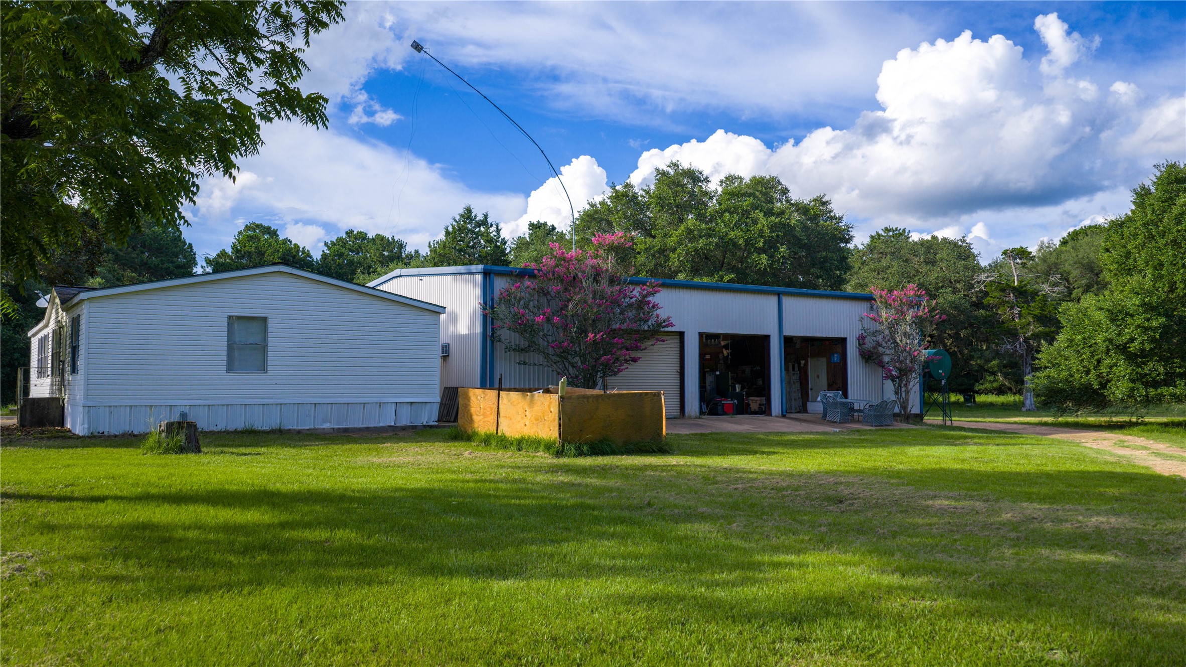 2080 Zimmerscheidt Road Columbus, TX 78934 - Photo 7 of 15 a view of a house with a yard and large tree