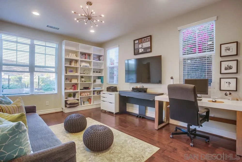 7535 Circulo Sequoia Carlsbad, CA 92009 - Photo 15 of 57 a living room with furniture and a flat screen tv