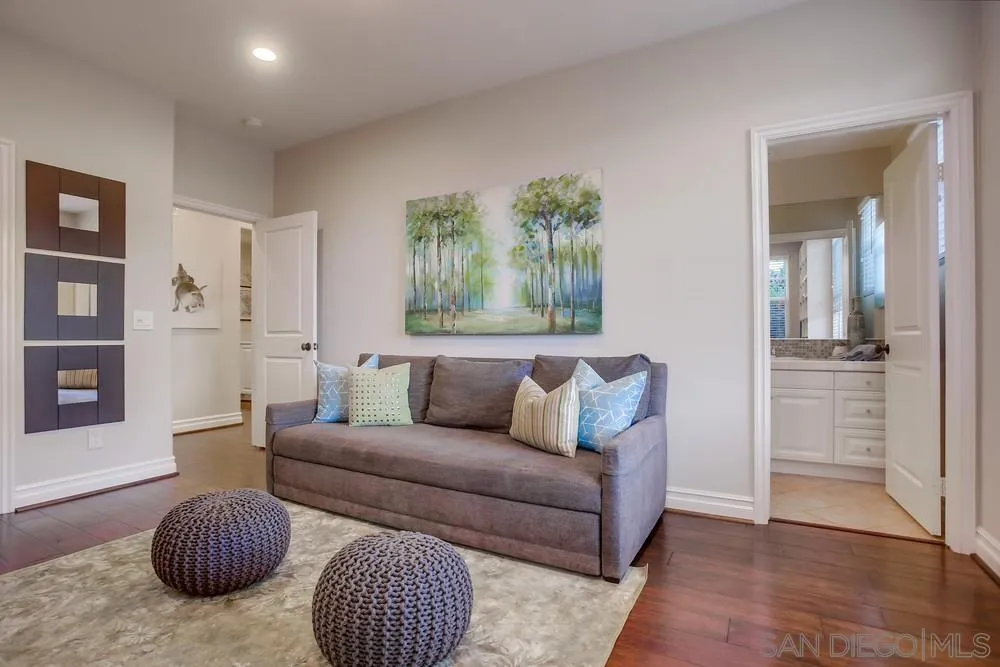 7535 Circulo Sequoia Carlsbad, CA 92009 - Photo 17 of 57 a living room with furniture and a rug
