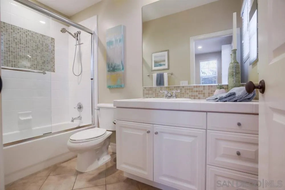7535 Circulo Sequoia Carlsbad, CA 92009 - Photo 18 of 57 a bathroom with a sink a toilet and shower