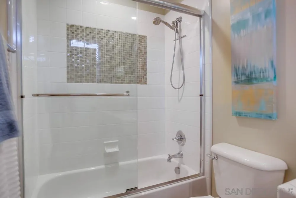 7535 Circulo Sequoia Carlsbad, CA 92009 - Photo 19 of 57 a bathroom with a shower and a toilet