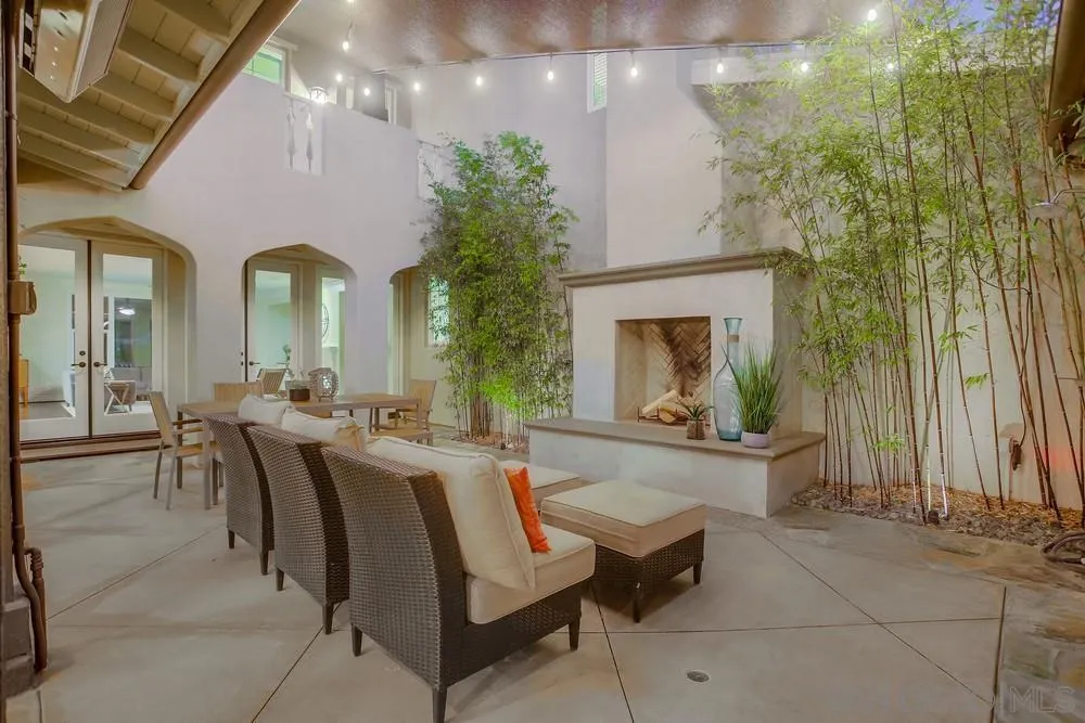 7535 Circulo Sequoia Carlsbad, CA 92009 - Photo 20 of 57 a dining room with furniture and a fireplace