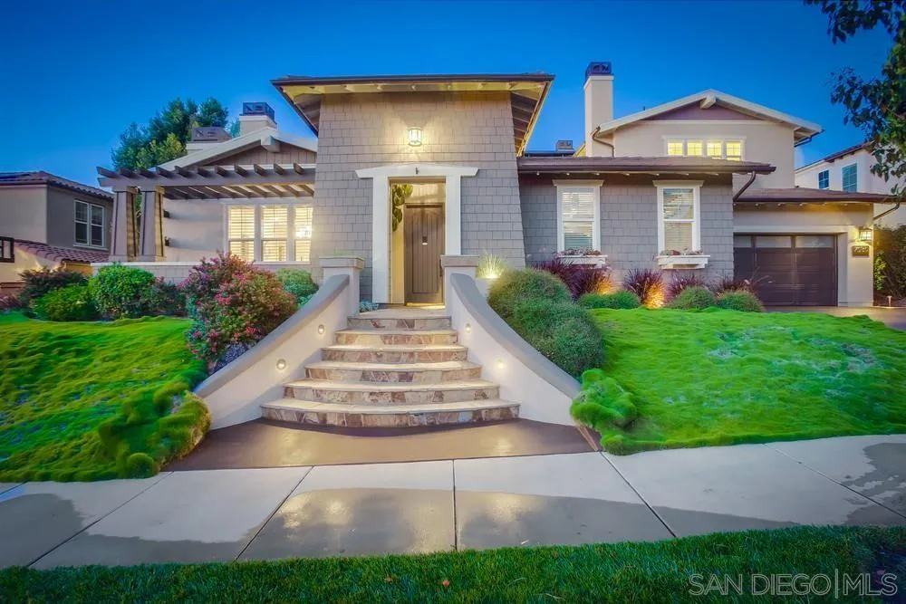 7535 Circulo Sequoia Carlsbad, CA 92009 - Photo 2 of 57 a front view of a house with a yard and potted plants