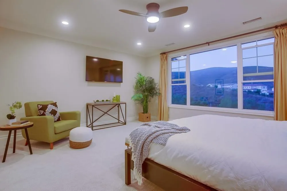 7535 Circulo Sequoia Carlsbad, CA 92009 - Photo 27 of 57 a spacious bedroom with a bed and a large window