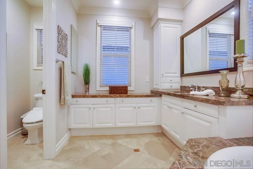 7535 Circulo Sequoia Carlsbad, CA 92009 - Photo 32 of 57 a spacious bathroom with a granite countertop sink and a toilet