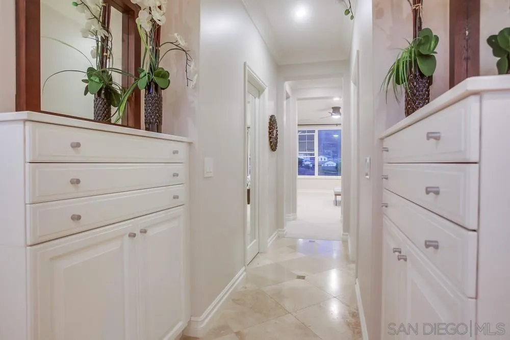 7535 Circulo Sequoia Carlsbad, CA 92009 - Photo 34 of 57 a view of a hallway with wooden floor