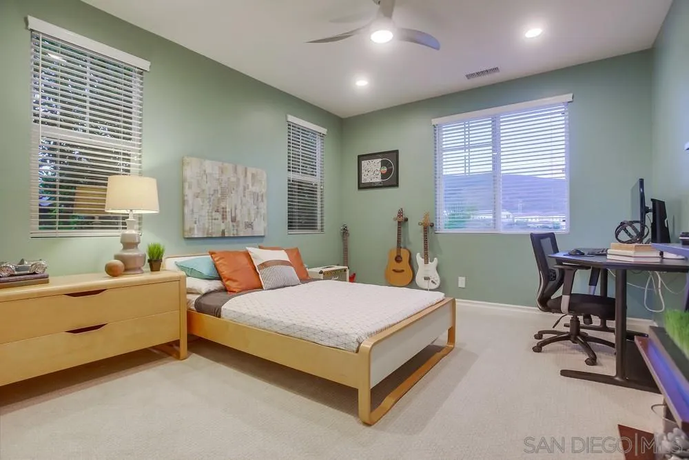 7535 Circulo Sequoia Carlsbad, CA 92009 - Photo 40 of 57 a bed room with a bed and a desk