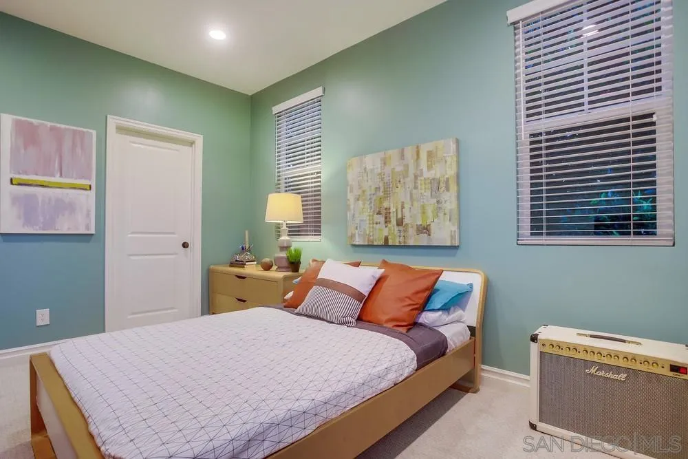 7535 Circulo Sequoia Carlsbad, CA 92009 - Photo 41 of 57 a bedroom with a bed and wooden floor