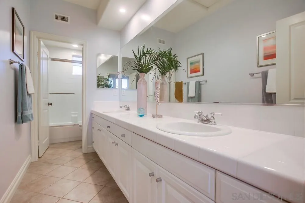 7535 Circulo Sequoia Carlsbad, CA 92009 - Photo 42 of 57 a bathroom with a double vanity sink mirror and next to a window