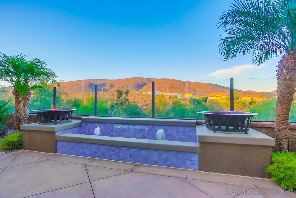 7535 Circulo Sequoia Carlsbad, CA 92009 - Photo 49 of 57 a patio with table and chairs
