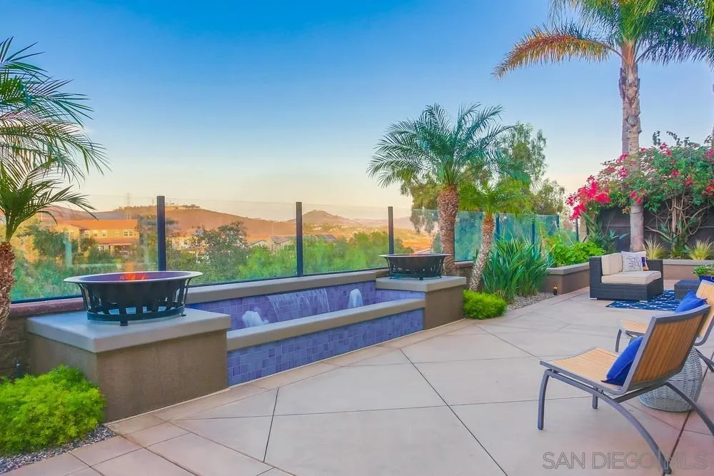 7535 Circulo Sequoia Carlsbad, CA 92009 - Photo 50 of 57 a view of a patio with couches and a fire pit