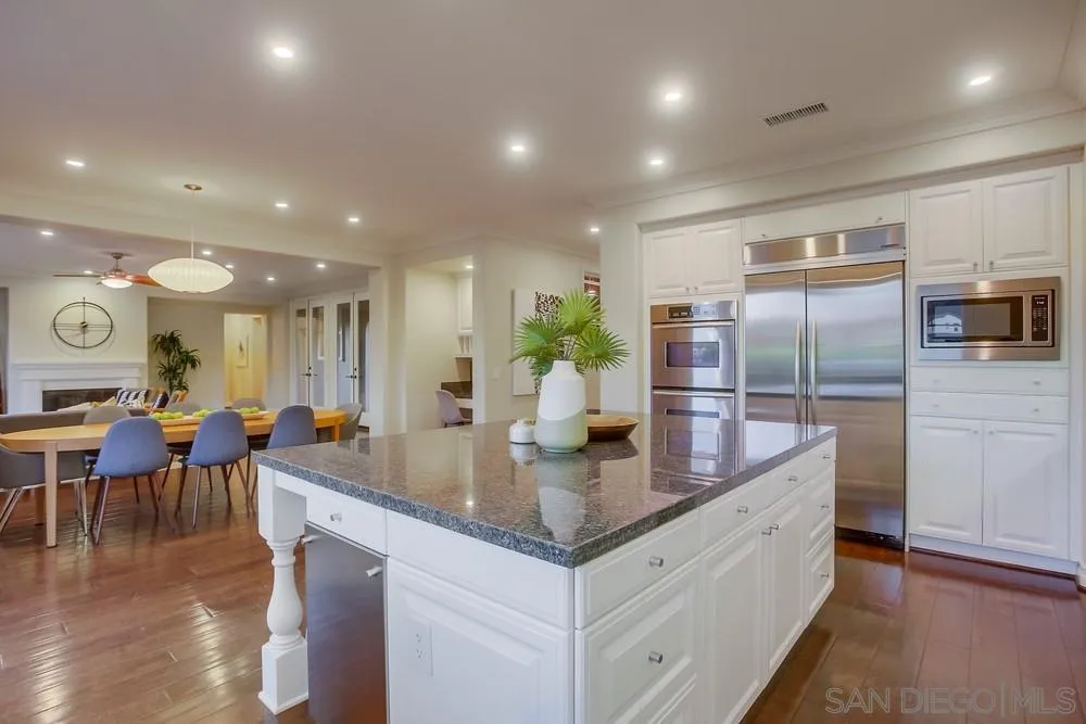 7535 Circulo Sequoia Carlsbad, CA 92009 - Photo 9 of 57 a large kitchen with stainless steel appliances lots of counter space