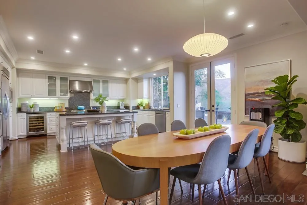 7535 Circulo Sequoia Carlsbad, CA 92009 - Photo 10 of 57 a view of a dining room with furniture window and wooden floor
