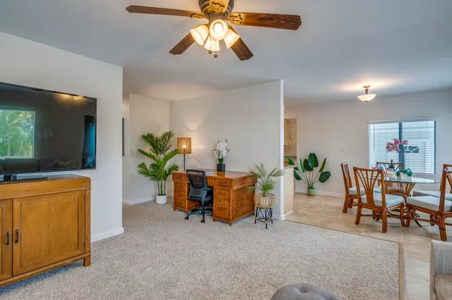 a kitchen with stainless steel appliances granite countertop a sink stove and microwave