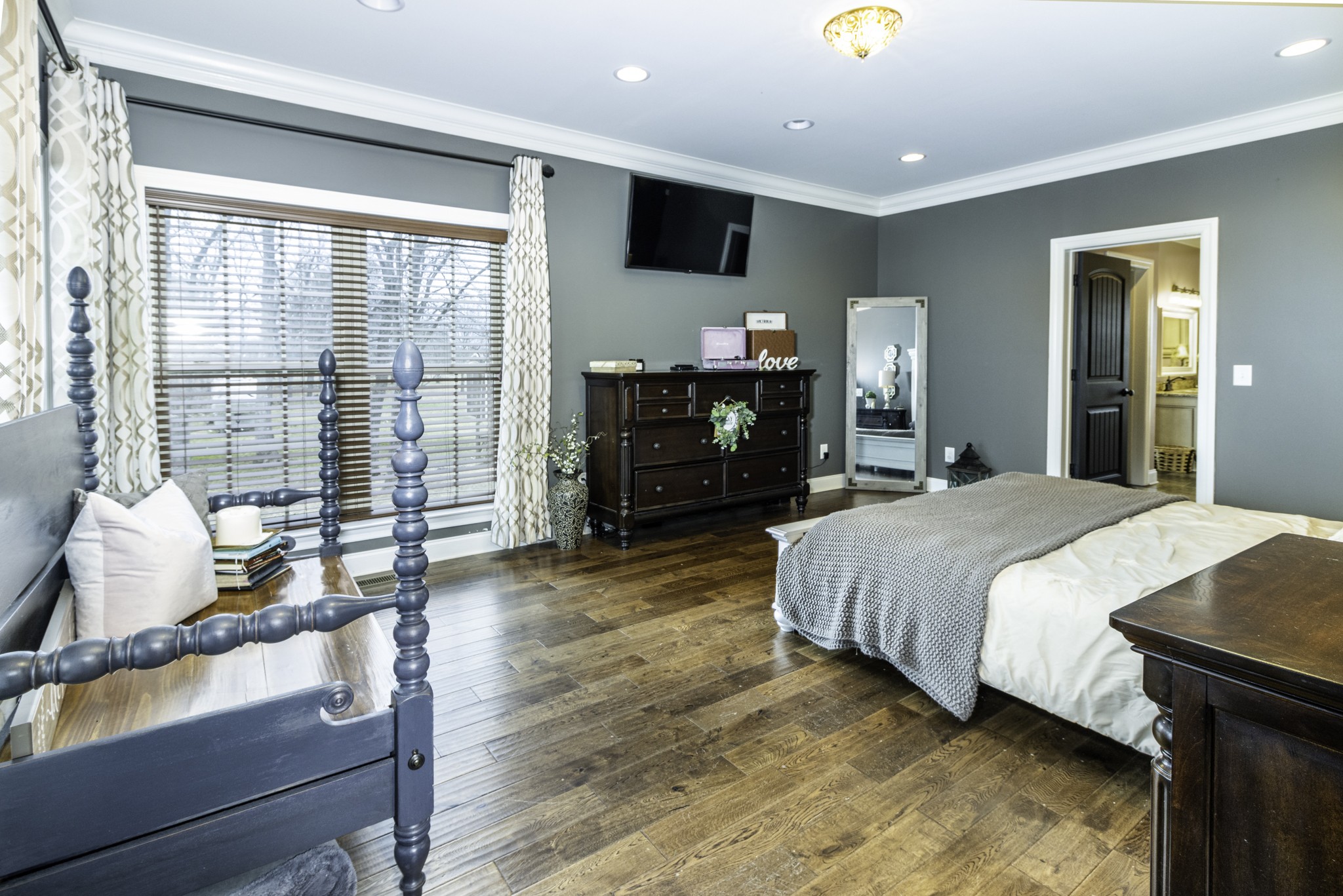 1705 Col James Hardin Road Clifton, TN 38425 - Photo 19 of 53 a spacious bedroom with a bed and large windows