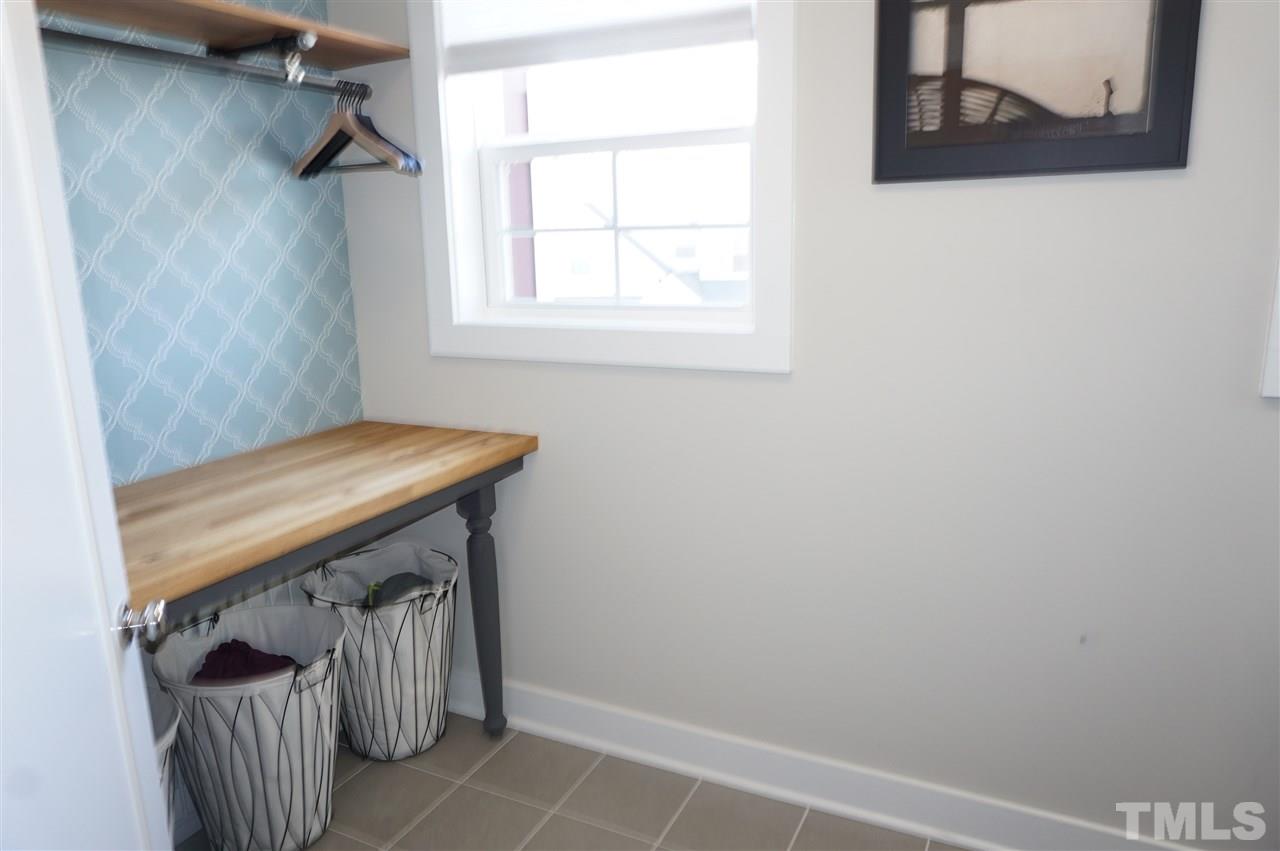 1720 Chestnut Falls Road Wendell, NC 27591 - Photo 26 of 30 Large laundry room with folding bench and hanger rod.