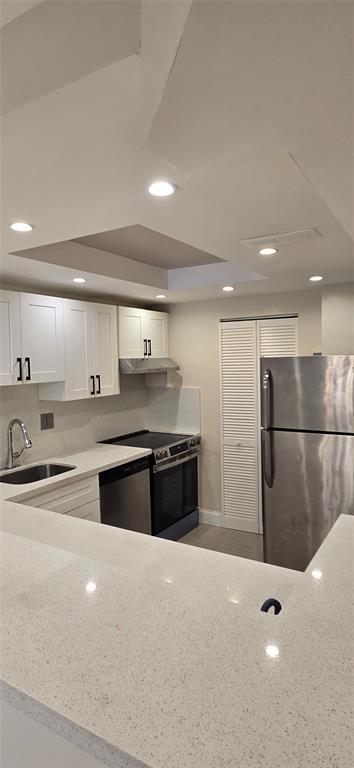 8000 South Colony Circle, Unit 309 Tamarac, FL 33321 - Photo 4 of 19 a large kitchen with stainless steel appliances a large counter top