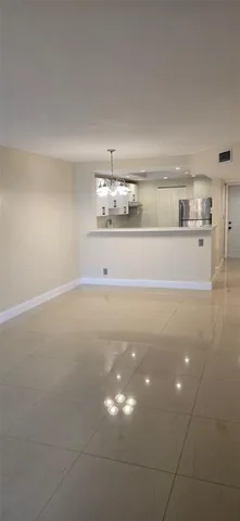 a view of kitchen cabinets and window