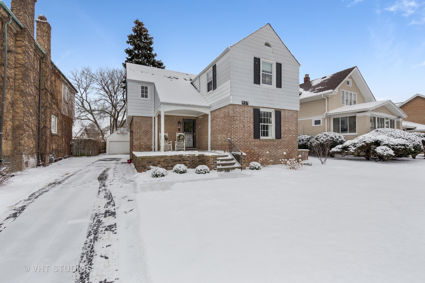 429 Shenstone Road Riverside, IL 60546 - Photo 1 of 16 a front view of a house with yard and covered with snow