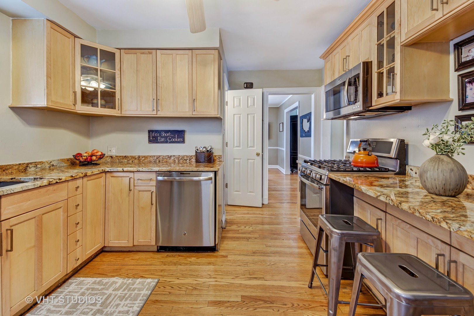 429 Shenstone Road Riverside, IL 60546 - Photo 3 of 16 a kitchen with stainless steel appliances granite countertop a stove a sink dishwasher and a refrigerator