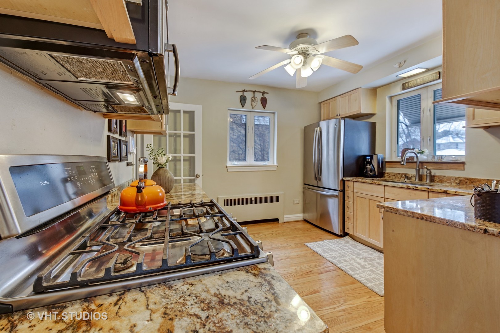 429 Shenstone Road Riverside, IL 60546 - Photo 7 of 16 a kitchen with stainless steel appliances granite countertop a stove refrigerator and cabinets
