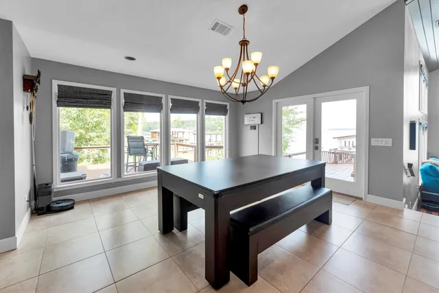 a kitchen with stainless steel appliances granite countertop a sink and a refrigerator