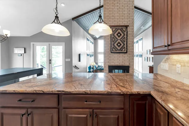 a living room with furniture a window and fireplace