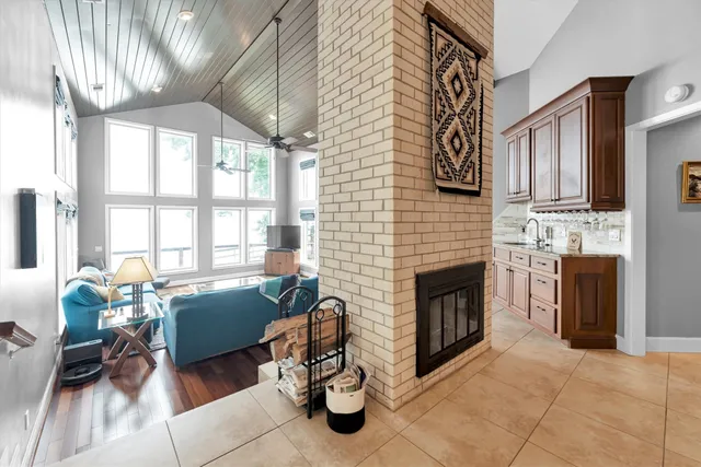 a bedroom with a large bed and a flat screen tv