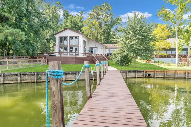 a front view of a house with a yard table and chairs