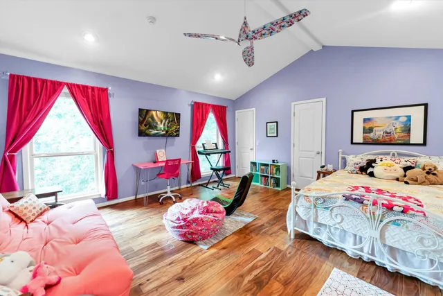 a view of a livingroom with furniture and a window