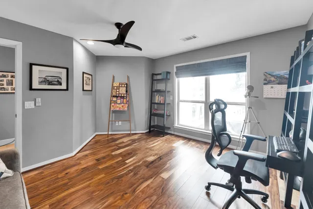 a view of a swimming pool with a yard