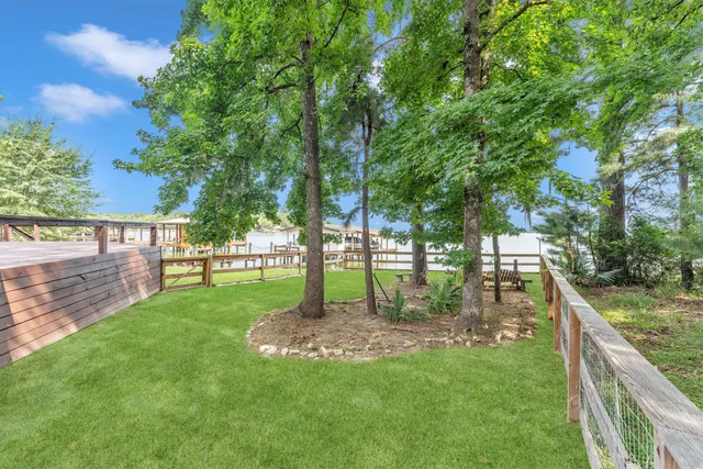 a kitchen with a sink window and wooden cabinets