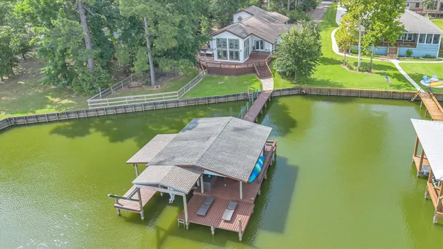 an aerial view of a house with a ocean view